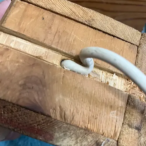 A bent and folded over wire