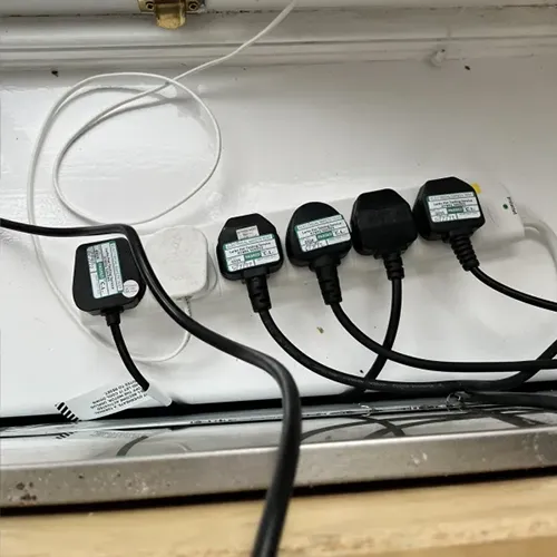 Extension cord with lots of plugs plugged in